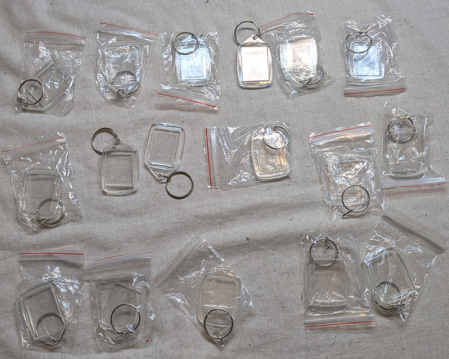 17 CROSS STITCH KEY RINGS SIZE 25MM X 35MM BITS INCLUDING P&P TO UK CODE 110